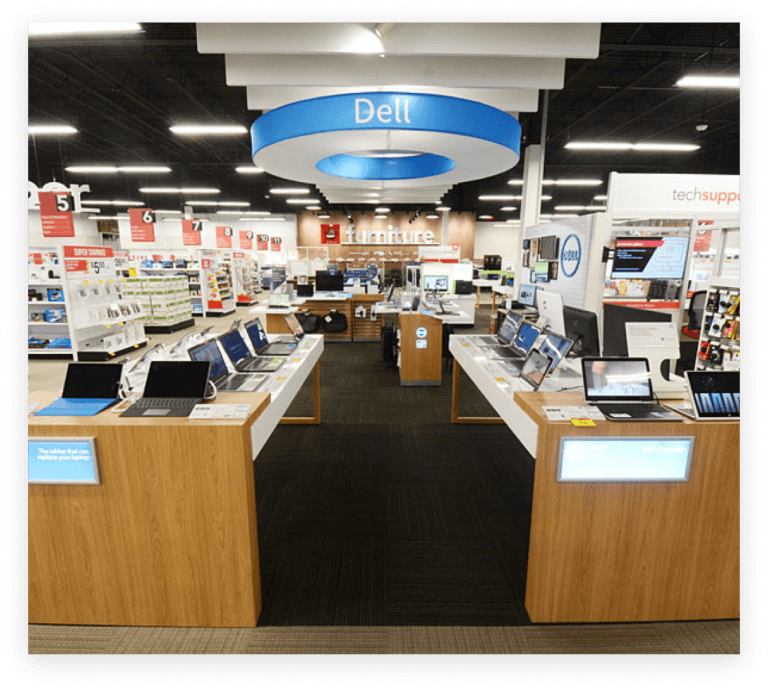 Computadores Dell em exibição segura em mesas na Office Depot